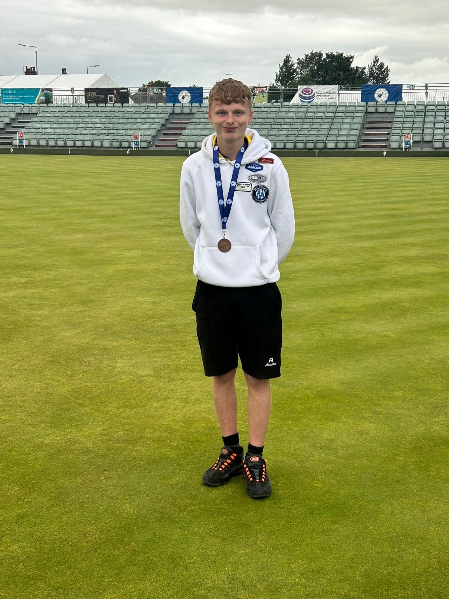 Kyle Malcolmson with his International Silver and National Bronze medals